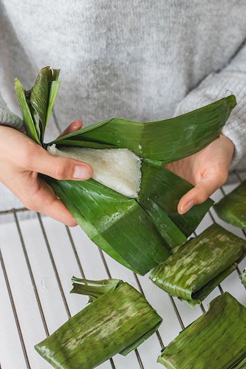 someone is peeling the leaves off of a plant