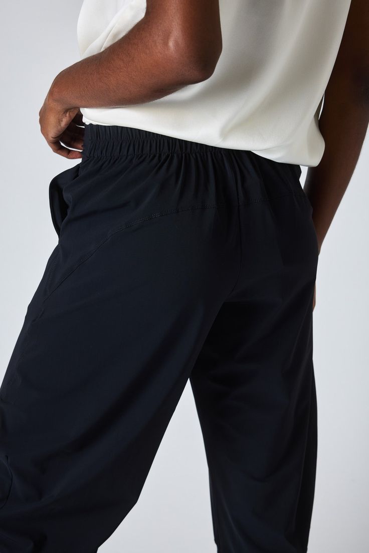 Our famous style in classic black. These pants are a standout yet comfortable pair. Style with your favorite blouse or top for an easy, everyday style. *We recommend taking one size down in this style if a closer fit is preferred. Hits above the ankle Slight stretch Relaxed fit Tapered leg Side pockets Black Activewear With Elastic Waistband And Tapered Leg, Black Relaxed Fit Straight Leg Activewear, Black Relaxed Fit Activewear With Straight Leg, Versatile Black Bottoms With Hip Pockets, Black Relaxed Fit Bottoms For Business Casual, Versatile Black Bottoms For Business Casual, Business Casual Black Bottoms With Side Pockets, Versatile Black Tapered Leg Bottoms, Black Athleisure Bottoms With Tapered Leg