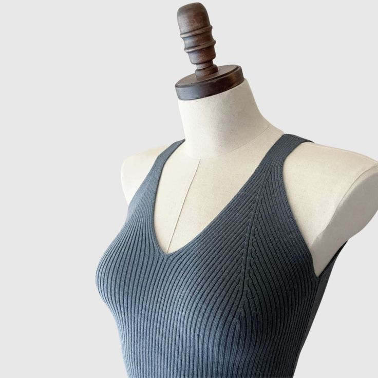 Elegant merino wool tank top. This soft and comfy tank top features a ribbed knit pattern that enhances the fabric's natural stretch and offers a figure-hugging fit. The v-neckline and wide shoulder straps provide a comfortable wear, while also giving it a contemporary edge. Professionally knitted. Features V-neckline, ideal for layering. Yarn Composition:100% Merino Wool Also available in 100% Cashmere option HERE. SIZING:Small/Medium: US size 4-8. Overall length: 21 inches. Measurements might Fitted Merino Wool V-neck Top, Fitted Ribbed Merino Wool Top, Ribbed Tank Sweater Vest, Ribbed Fitted Tank Sweater Vest, Fitted Ribbed Tank Sweater Vest, Ribbed Merino Wool Tops For Layering, Knit Tank Top For Layering With Ribbed Neckline, Ribbed Knit Tank Top For Layering, Fitted Ribbed Sweater Vest For Layering