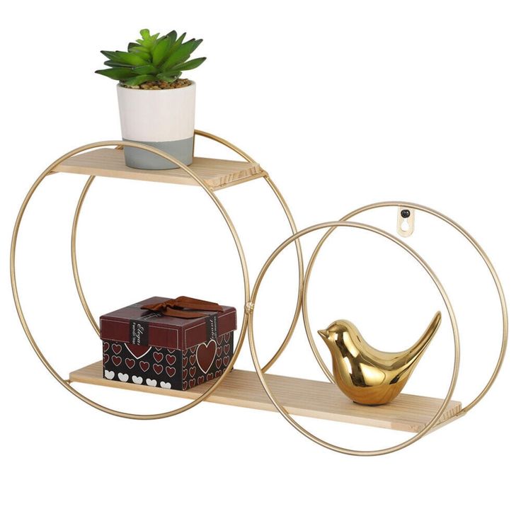 two circular shelves with plants on them and a small bird figurine in the middle