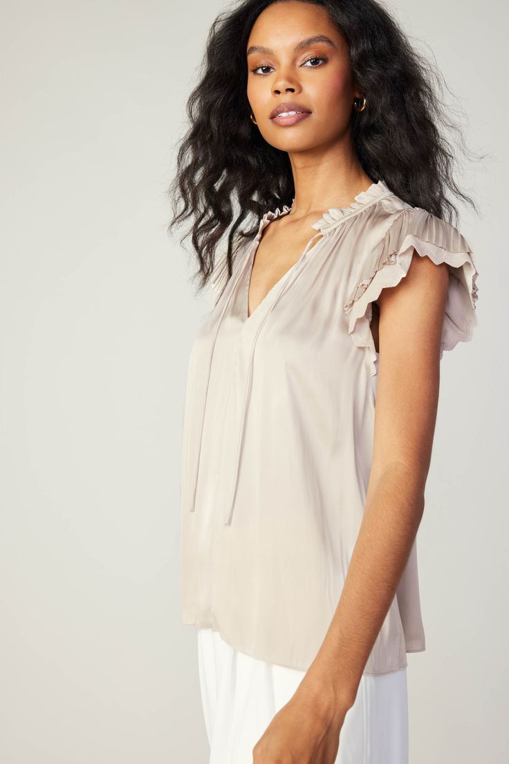 Detail upon detail. Double-layered short sleeves accent this split-neck top—check out the texture contrast of fluttery raw-edged pleats and eyelet-detailed scallops. This lightweight number has a relaxed, easy fit that's finished with ruffle trim and a dainty tie at the front. •Split neckline with self-tie •Ruffle trim •Double-layered short sleeves •Relaxed fit Item number 2430189 50%RECYCLE POLY 50%POLY Gentle cycle cold Texture Contrast, Layered Short, Modern Monochrome, Lace Sleeve Top, Print Trends, Vacation Dresses, Sweater Sale, Short Jumpsuit, Trending Dresses