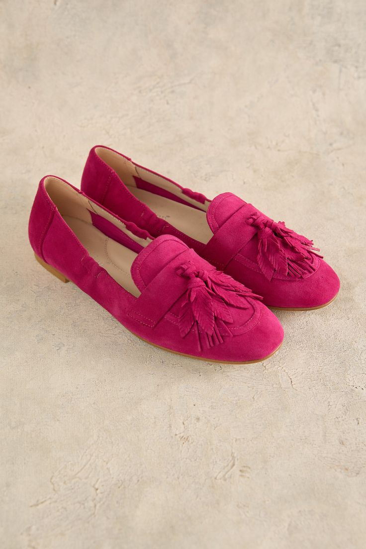 Take bold strides in our Bright Pink Monet Tassel Loafer. Crafted in Spain from suede and back by popular demand in this new colourway, this is a super-soft slip on shoe which features an inner sole that will mold to the shape of your foot. Suede Round Toe Loafers For Spring, Pink Flat Loafers With Leather Sole, Pink Loafers With Leather Sole, Pink Leather Sole Flat Loafers, Spring Tassel Slip-on Loafers, Casual Suede Tassel Loafers With Rubber Sole, Casual Suede Tassel Loafers With Flat Heel, Casual Suede Tassel Loafers, Casual Slip-on Loafers With Tassels