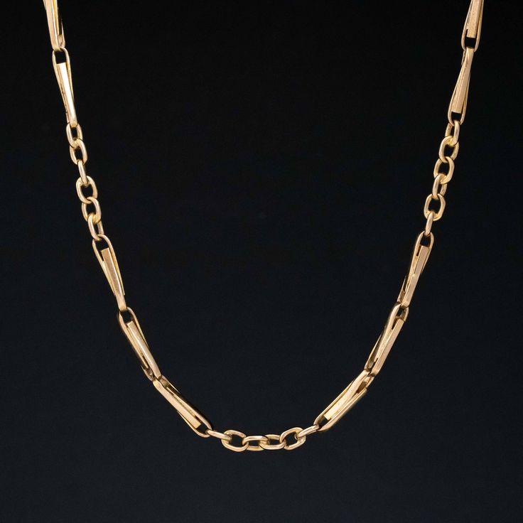 Another chain with beautiful links and understated style. Perfect length for hanging one's pendant or charms on. Super chic! 18kt yellow gold 19" in length 19.3 grams 14k Gold Figaro Chain Link Necklace, Formal Figaro Chain Link Necklace, Classic 14k Gold Necklace With Rectangular Links, Formal 14k Gold Link Chain Necklace, Classic Gold Chain Necklaces With Rectangular Links, Yellow Gold Figaro Chain Necklace With Oval Links, Yellow Gold Link Chain Necklace, 14k Gold Oval Link Figaro Chain Necklace, Timeless 14k Gold Chain Necklace With Rectangular Links