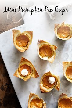 mini pumpkin pie cups on a marble platter with text overlay that reads mini pumpkin pie cups