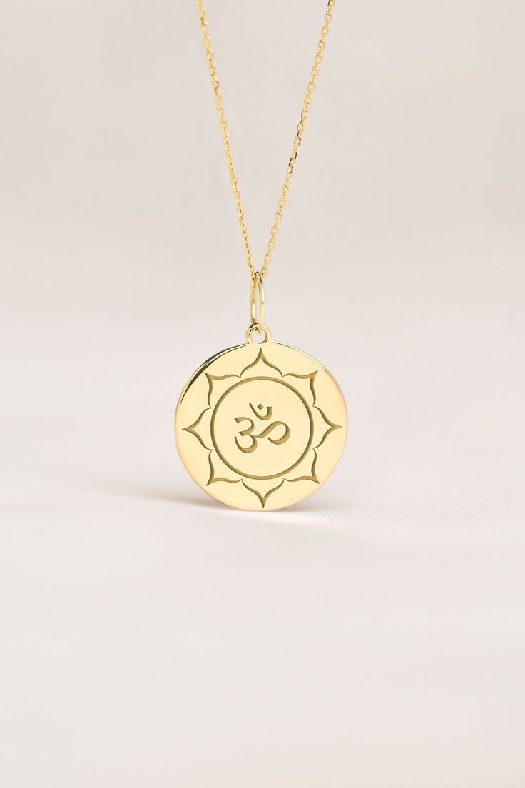 Om represents yoga, spirituality, and peace in body, in mid and spirit. This pendant is a meaningful gift for Birthdays, Anniversaries and Weddings. ● 14K SOLID GOLD ● FREE BACK SIDE PERSONALIZATION ● FREE SHIPPING  ● Inner diameter of the jump ring is 4mm ● Pendant thickness is 0.5mm 🇺🇸 All items are HANDMADE IN USA 🇺🇸 All materials are sourced from USA ● Chain Length Options    - Without Chain    - 40 cm / 16 inches    - 45 cm / 18 inches    - 50 cm / 20 inches ● Pendant Size Options    - Spiritual Round Necklaces For Meditation, Spiritual Birth Flower Pendant Charm Necklace, Spiritual Birth Flower Pendant Necklace, Spiritual Medallion Charm Necklace Gift, Spiritual Medallion Charm Necklace For Gifts, Engraved Symbolic Necklace For Meditation, Symbolic Necklaces For Meditation And Festivals, Symbolic Healing Jewelry Personalized, Symbolic Personalized Healing Jewelry