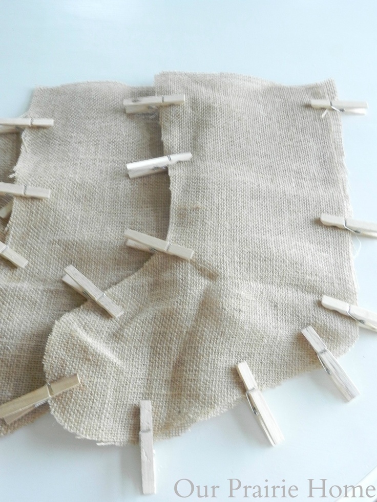 several pieces of cloth with clothes pins sticking out of them