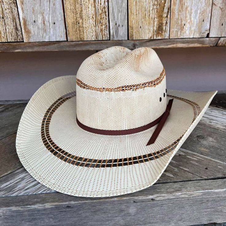 Youth Ariat Hat, your youngster will flaunt their western flair with this Ariat hat from M & F Western Products. It features a two-cord golden brown hatband and boasts a rugged, durable design crafted from premium materials. Brim 4" Crown 4' Color - Brown/Off-White Bangora Straw Stretch to Fit Band Size: L (up to 53.5 cm) and XL (up to 56 cm) Southern Style Brown Hat Bands For Rodeo, Southern Style Brown Hat Band For Rodeo, Brown Southern Style Hat For Rodeo, Rustic Ranch Hat With Short Brim, Southern Style Brown Hat For Ranch, Southern Style Brown Hat, Adjustable Hats With Single Vent For Rodeo, Adjustable Rodeo Hat With Single Vent, Adjustable Hat With Single Vent For Rodeo