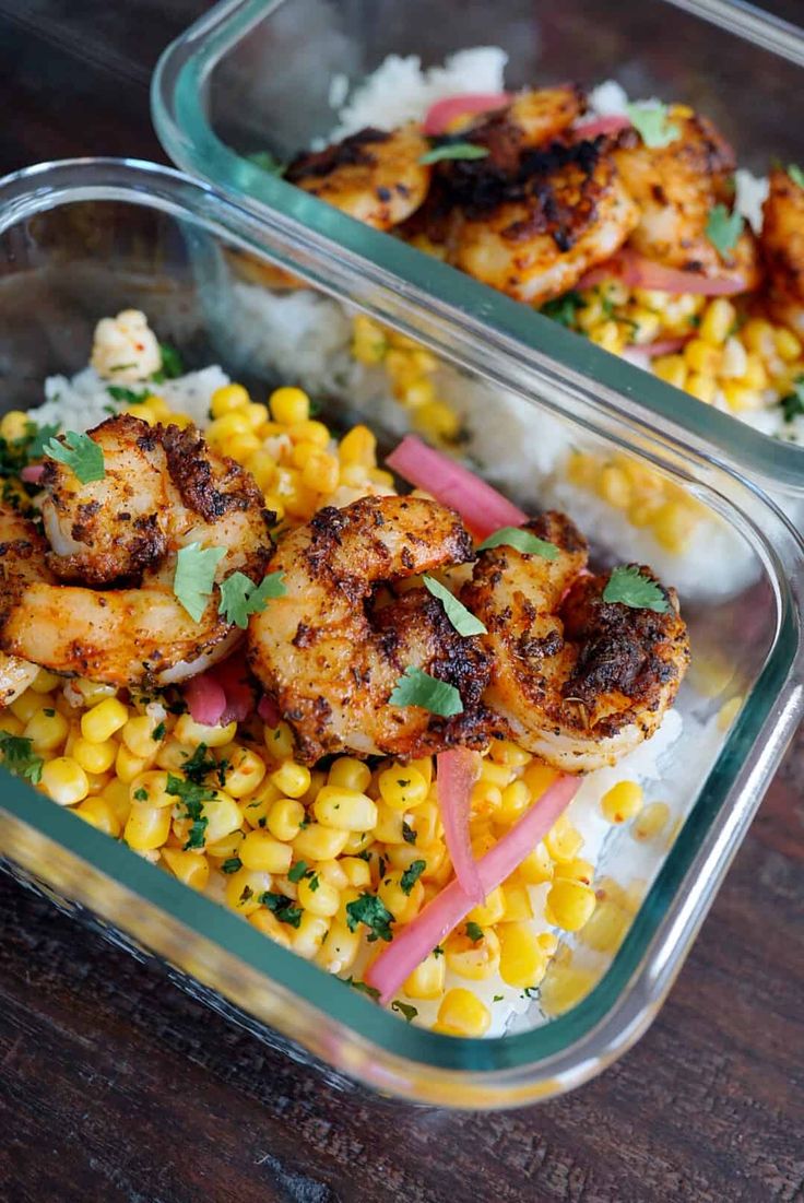 two plastic containers filled with shrimp and corn on top of rice covered in cilantro