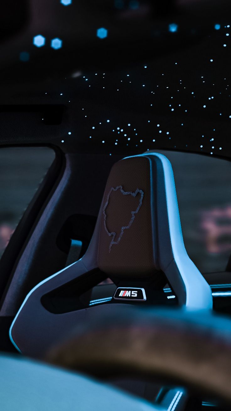 the interior of a car with its dash lights on