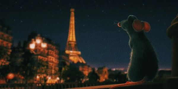 a rat looking at the eiffel tower in paris