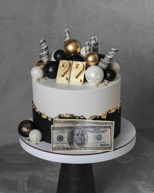 a birthday cake decorated with money and decorations