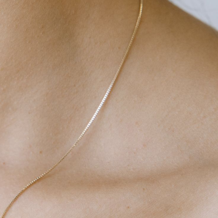 A shimmery, dainty box chain necklace. Wear it solo or layered alongside your favorite pendants and chains (it plays well with others!). The length is layering friendly with an adjustable length between 18"-21". .9mm thick. Our materials make for an amazing, high quality, seamless, jewelry piece with longevity. Our necklaces are plated with 18k gold, 18k rose gold, or rhodium and finished with a protective coating. A little secret we’ll keep between us: it looks way more than it costs. Box Chain Necklace, Necklace Rose Gold, Versatile Jewelry, Bow Jewelry, Between Us, Necklace Rose, Delicate Jewelry, Silver Chain Necklace, Rose Gold Necklace