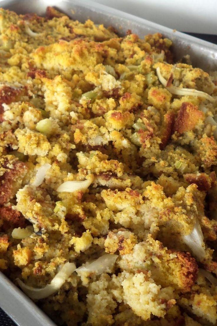 a casserole dish filled with stuffing and vegetables