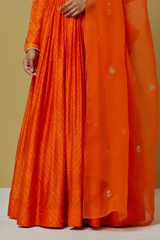 Orange chanderi anarkali with bandhani print and sequin embroidered motifs. Paired with dupatta.
Components:2
Pattern:Printed, Embroidered
Type of Work:Bandhani, sequin
Neckline:Round
Sleeve Length:Long sleeves
Fabric:Chanderi, organza
Color:Orange
Other Details:
Back cut-out
Sheer dupatta
Occasion:Puja - Aza Fashions Chanderi Anarkali, Anarkali With Dupatta, Sheer Dupatta, Bandhani Print, Women Kurta, Embroidered Motifs, Types Of Work, Anarkali, Aza Fashion