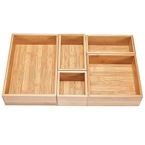 four compartments in a wooden box on a white background