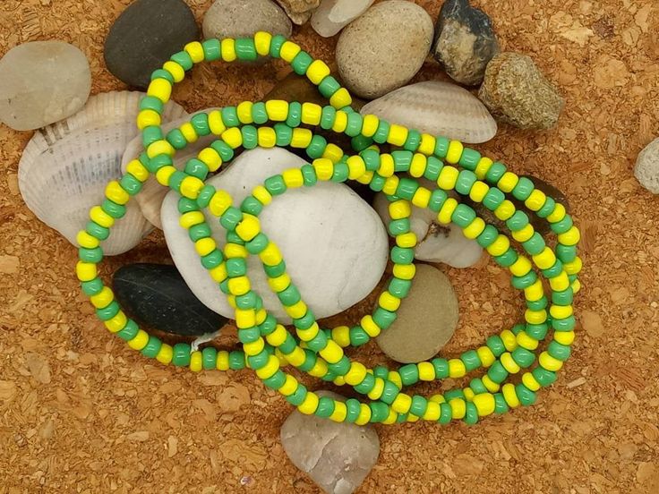 "Beautiful Handmade Elkes for Orula These are made with green and yellow beads Approx. 32\" in length (when opened) 16\" in length when tied" Adjustable Yellow Single Strand Beaded Necklaces, Adjustable Yellow Single Strand Beaded Necklace, Adjustable Single Strand Yellow Beaded Necklaces, Adjustable Single Strand Yellow Beaded Necklace, Traditional Green Beads For Festival, Green Oval Beaded Chain Jewelry, Traditional Green Beaded Necklace With Large Beads, Hand-strung Yellow Beaded Necklaces For Festival, Green Beaded Necklaces For The Beach