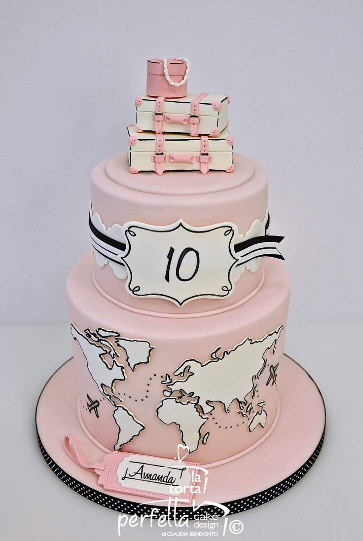 a pink and white cake with the number ten on it's top is shown