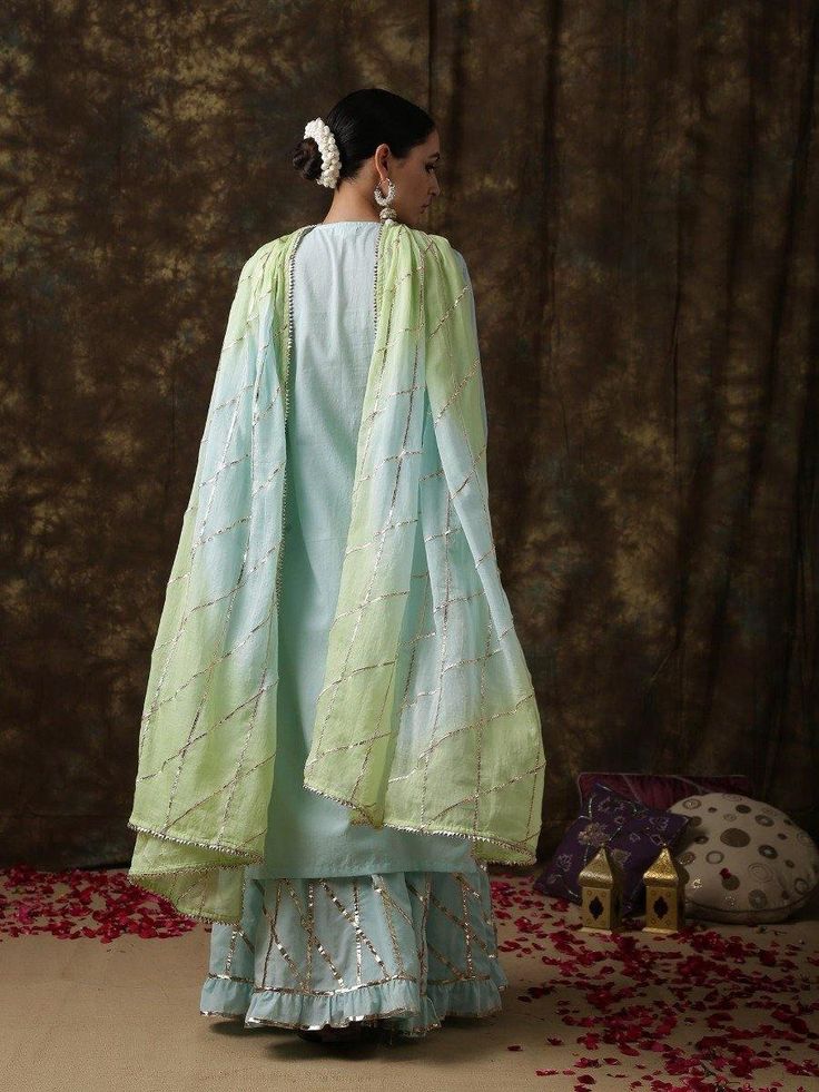 Ambika - Neel Sharara set - Trendroots Traditional Turquoise Dupatta With Dabka Work, Turquoise Kurta With Zari Work For Festive Occasions, Pista Green Palazzo Set With Mirror Work, Light Blue Kurta With Dupatta For Festivals, Festive Turquoise Kurta With Zari Work, Turquoise Traditional Drape Sets With Zari Work, Designer Turquoise Sets With Resham Embroidery, Turquoise Resham Embroidery Dupatta Traditional Drape, Pista Green Palazzo Set With Gota Work