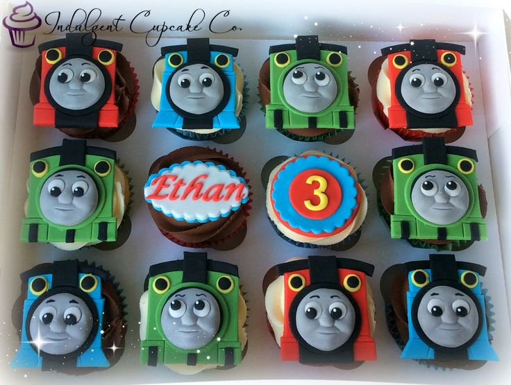 thomas the train cupcakes in a box with name and number on each one