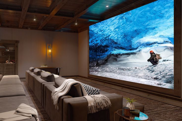 a large screen in the middle of a living room