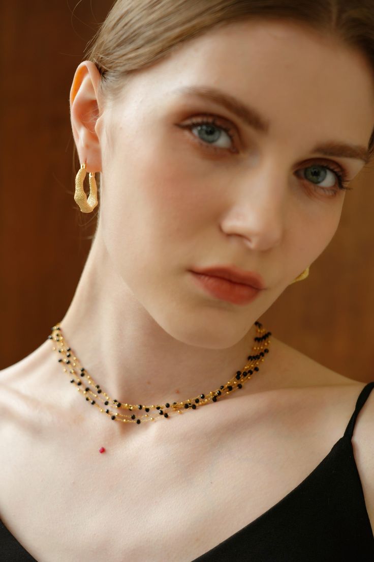 Ever wondered how nature and luxury could collide? Meet the Soraya Agate Mix 18k Gold Necklace – a playful dance of earthy agate stones and chic gold. Each piece is handpicked, creating a vibrant and modern necklace that effortlessly elevates your style. Embrace the fusion of nature and elegance in this stunning accessory. Gold Round Beads Fusion Necklace, Fusion Style Gold Beaded Necklaces, Gold Fusion Beaded Necklaces With Round Beads, Modern Polished Beads Necklace For Gift, Festive Gold Gemstone Necklace, Gold Fusion Jewelry With Gemstones, Gemstone Long Necklace Jewelry For Parties, Elegant Gemstone Beaded Choker Necklaces, Gold Onyx Pendant Jewelry