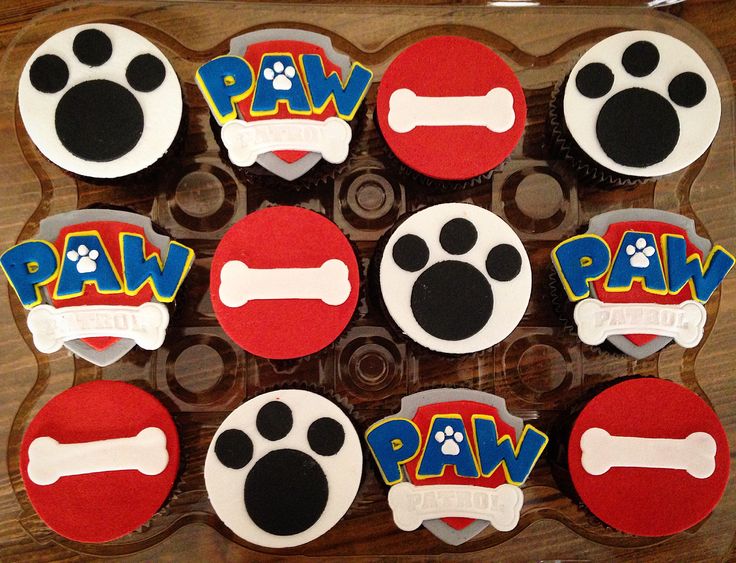 decorated cupcakes with paw and bones on them