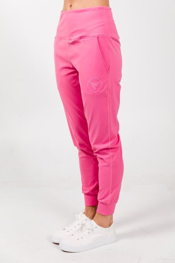 Description Our comfiest jogger yet for all of our sports. Made in a silky light material with bold colors and design to make your outfits pop anywhere you go. Great for the range, courts, or just running errands. So comfy you won't want to take it off. Available in pink, iced aqua, and beige. Detail Lightweight UV protection Dri-fit High waisted Side pockets Imported 85% Polyester / 15% Spandex FIT Regular Fit Comfort Stretch Joggers With Elastic Side Panels, Casual Comfort Stretch Running Bottoms, Casual Running Bottoms With Comfort Stretch, Stretch Comfort Waistband Joggers For Jogging, Trendy Pink Sweatpants For Sports, 4-way Stretch Go-dry Joggers For Jogging, Trendy Sports Sweatpants With Elastic Waistband, Go-dry 4-way Stretch Joggers For Jogging, Pink Activewear With Ribbed Waistband For Sports