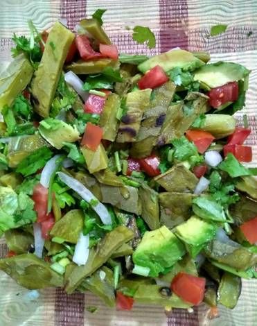 a salad with lettuce, tomatoes and onions