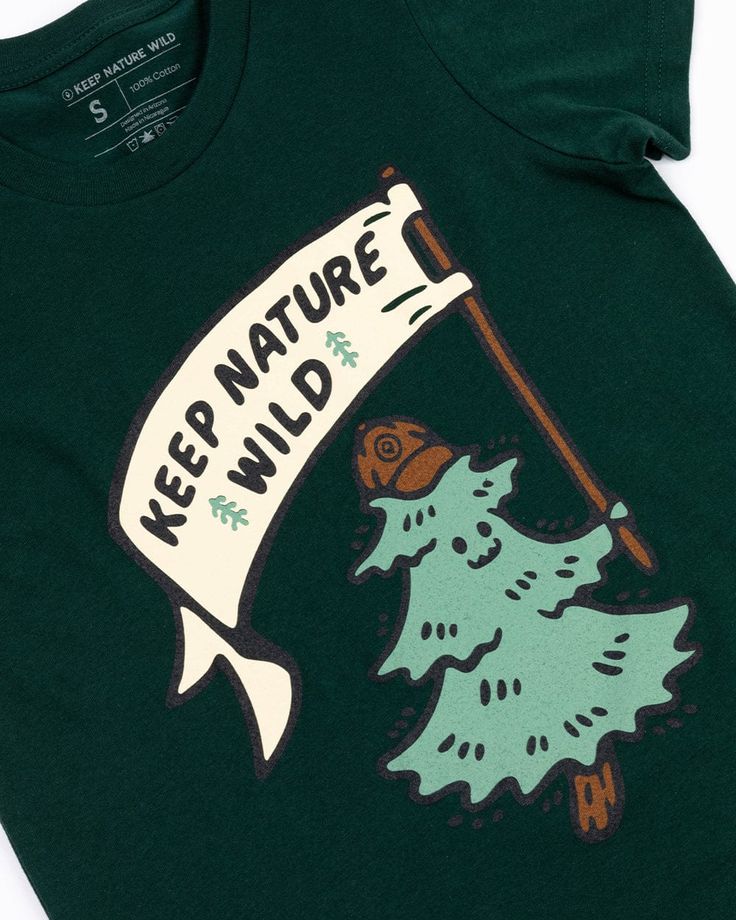 Hold it high & wave it proud! This tee is designed for your forest-dwelling kid to celebrate their love for nature. It's unbelievably comfy + soft, and holds up to the wear & tear of little explorers! Regular fit Lightweight Cotton/poly blend We’re not your average outdoor brand... together we pick up one pound of trash for every product sold. Learn more and join a cleanup here! Cheap Graphic Print Camp Shirt For Outdoor Activities, Cheap Graphic Tee Camp Shirt, Cheap Retro Camp Shirt For Spring, Cheap Patterned Camp Shirt With Graphic Print, Affordable Trendy Outdoor T-shirt, Cheap Trendy Graphic Camp Shirt, Cheap Graphic Tee Shirt For Outdoor, Cheap Graphic Print Camp Shirt For Adventure, Cheap Trendy Graphic Print Camp Shirt