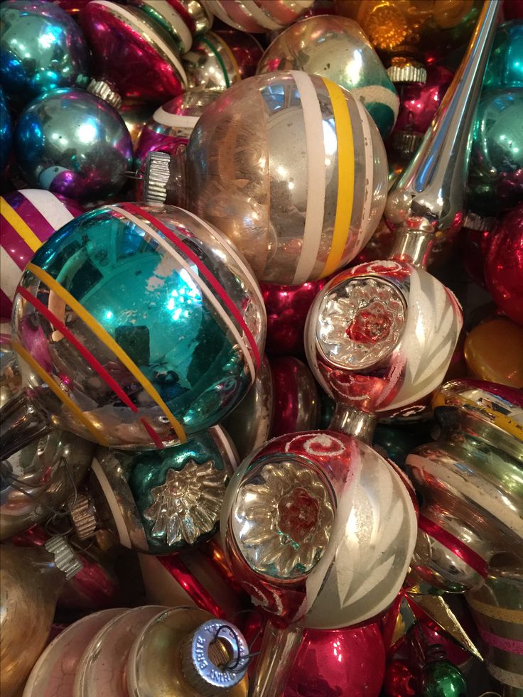 a pile of christmas ornaments sitting on top of each other