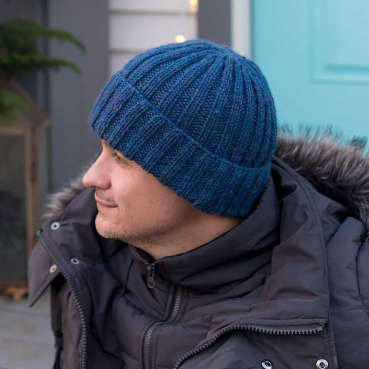 a man wearing a blue hat and jacket