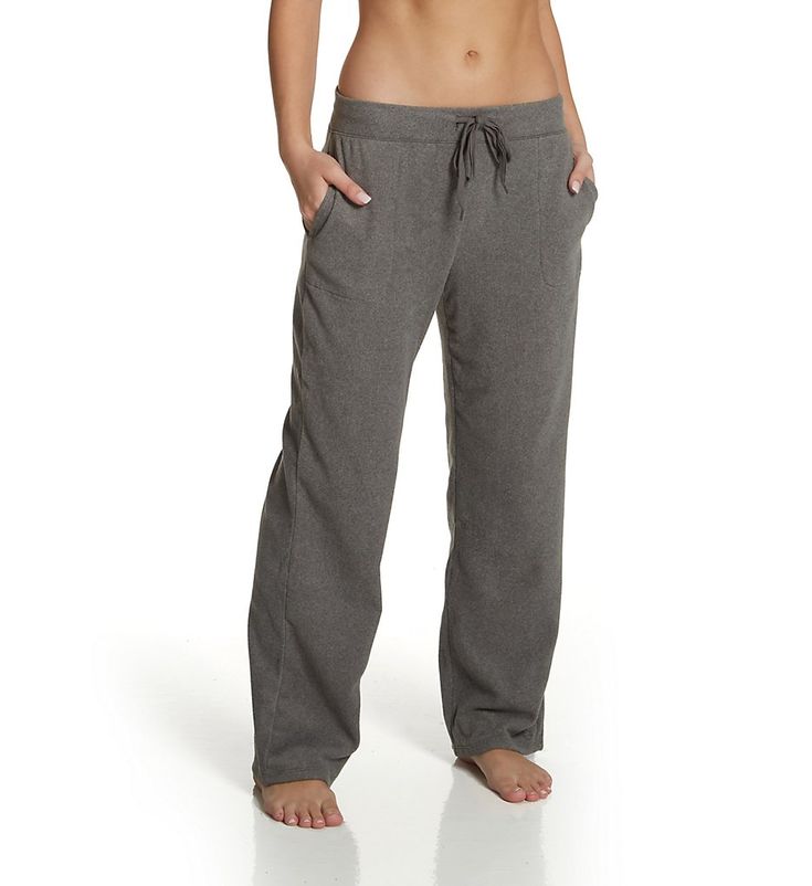 This extra comfy lounge pant is made from a soft fleece with a relaxed fit for ultimate coziness. Made from polyester and spandex for stretch. Wide, covered elastic waistband adjusts with flat, woven drawstring for the perfect fit. Drawstring has coated metal end caps. Large pockets at the side seams for convenience. Center back seam gives the fit definition. Cuddl Duds logo embroidered above the left leg hem. Wide, straight legs have self-lined hems. High waisted for modern look. Full length. R Cozy Fleece Sweatpants For Loungewear, Super Soft Comfortable Bottoms For Leisure, Comfortable Super Soft Bottoms For Leisure, Cozy Bottoms For Relaxation, Cozy Activewear With Pockets For Lounging, Cozy Casual Activewear With Pockets, Cozy Fit Fleece Bottoms For Loungewear, Fleece Bottoms With Comfort Waistband For Loungewear, Comfortable Fleece Bottoms For Loungewear