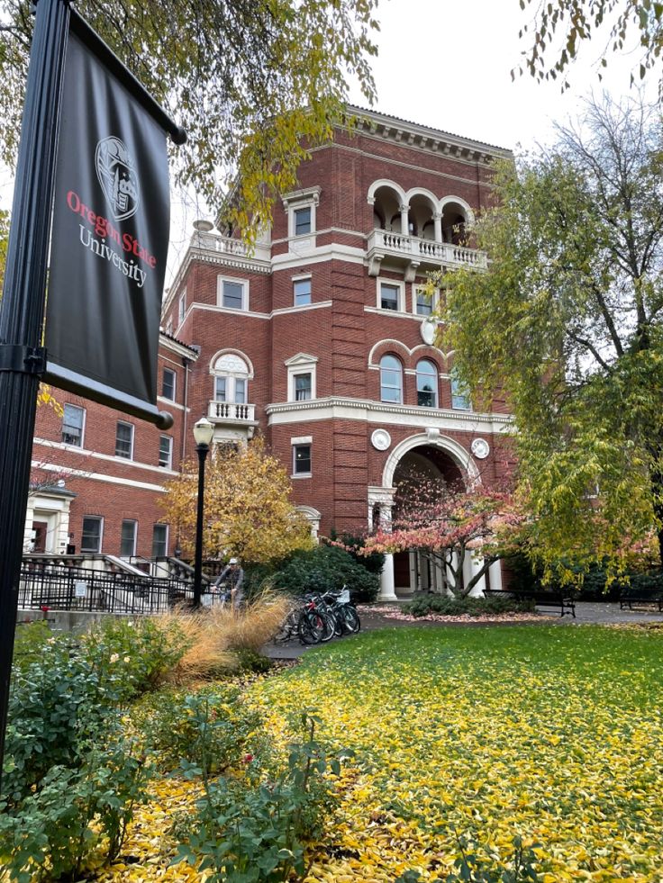 an old brick building with a sign in front of it that says the university of chicago