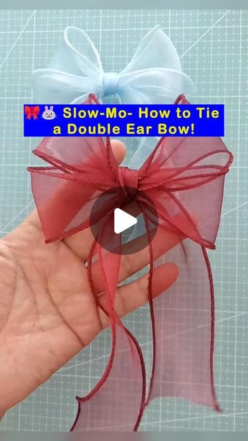 someone is holding a bow in their hand with the words slow - mac how to tie a double ear bow