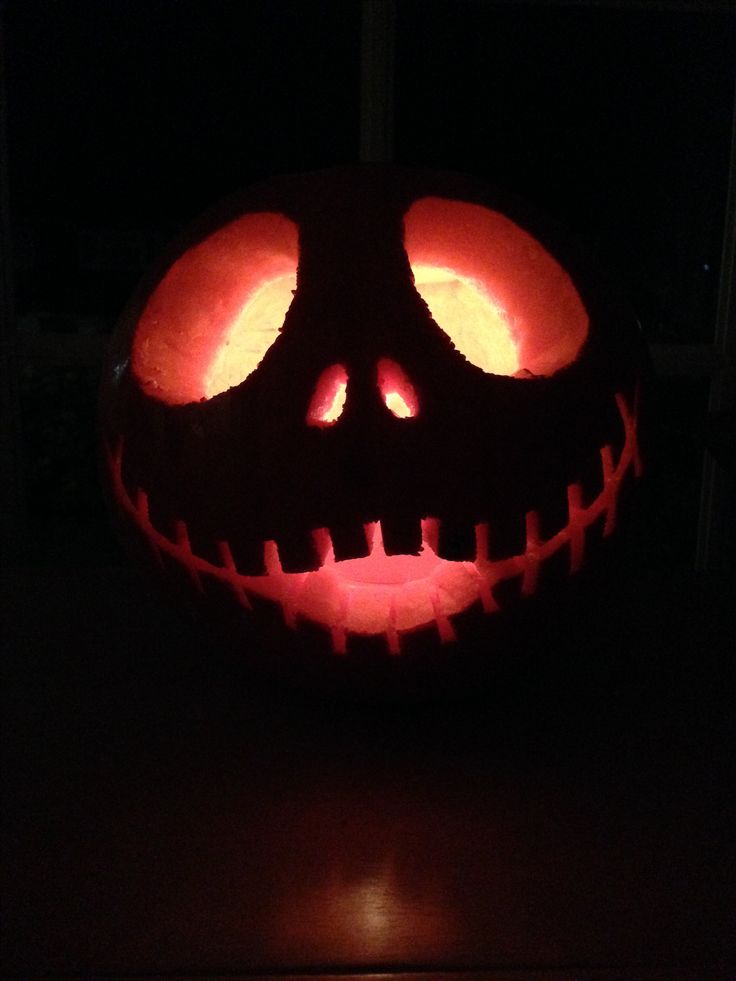 a jack o lantern pumpkin with glowing eyes