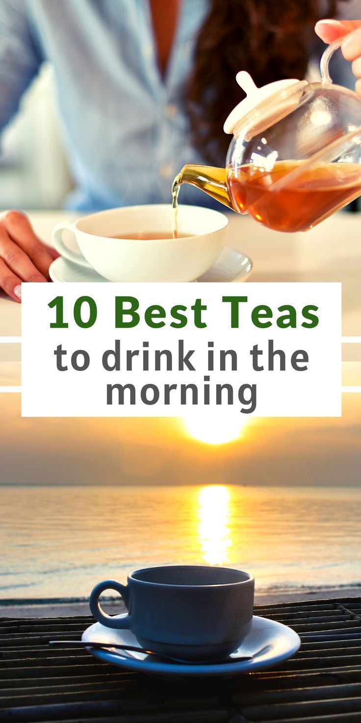 a woman pouring tea into a cup on top of a table with the sun setting in the background