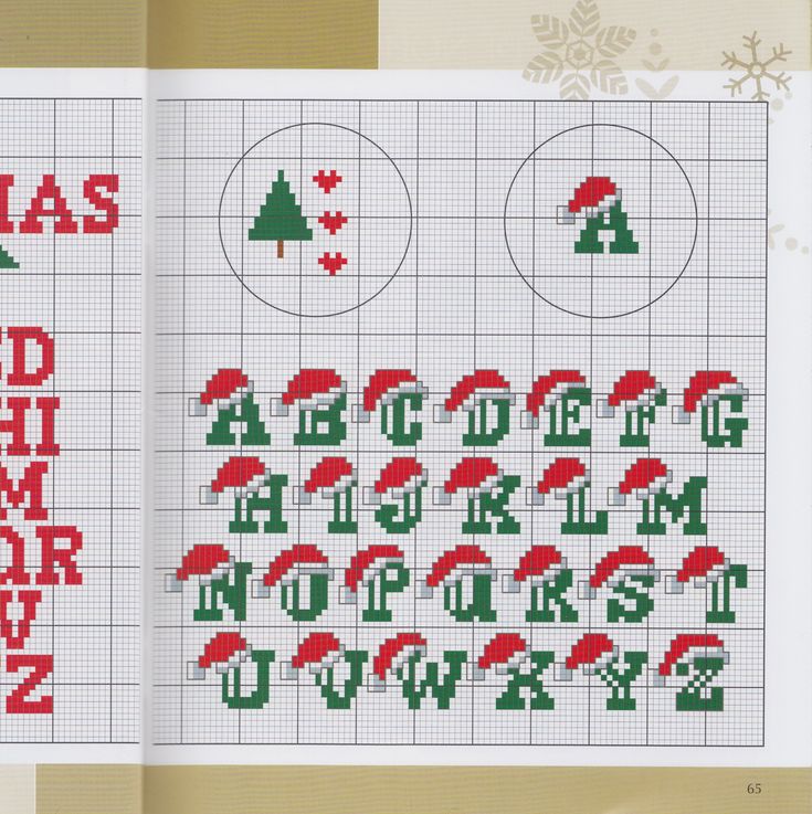 cross stitch christmas alphabets and numbers are displayed in an open book with the letters on it