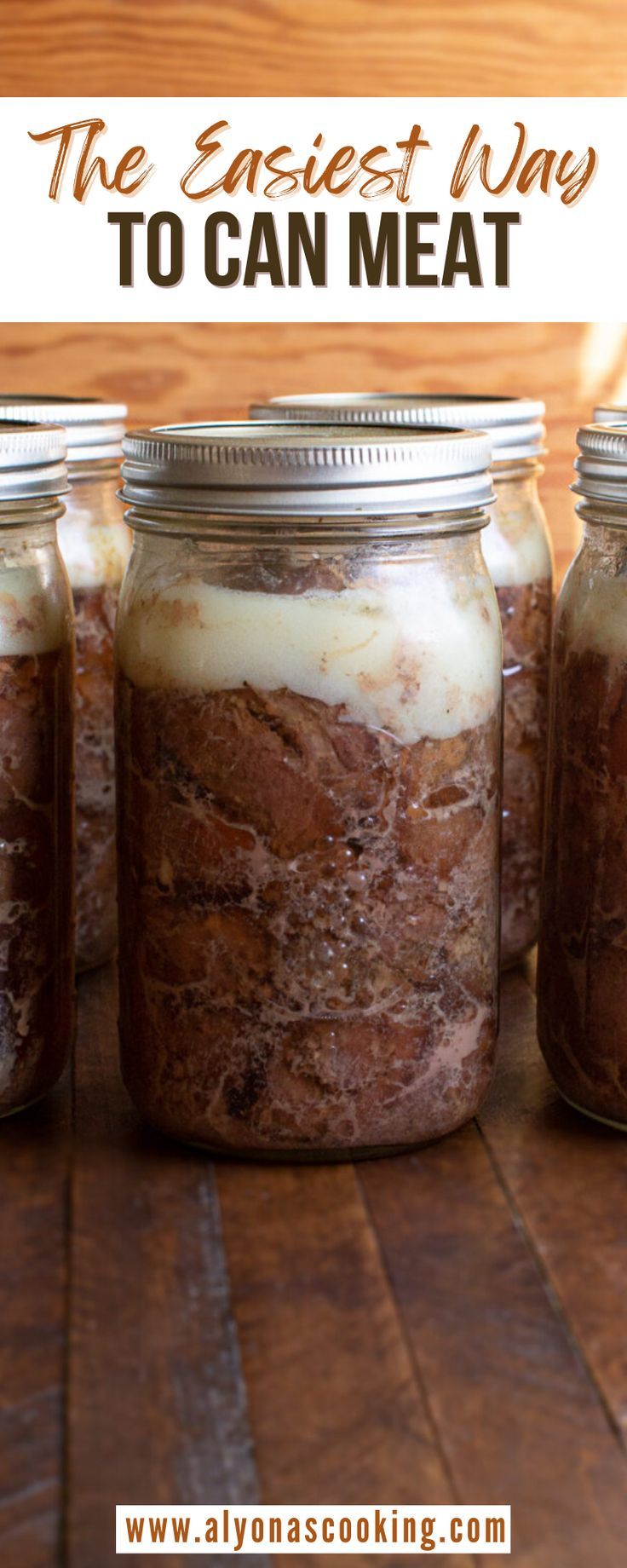 four jars filled with food sitting on top of a wooden table