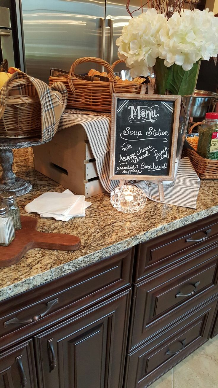 a kitchen counter topped with lots of food