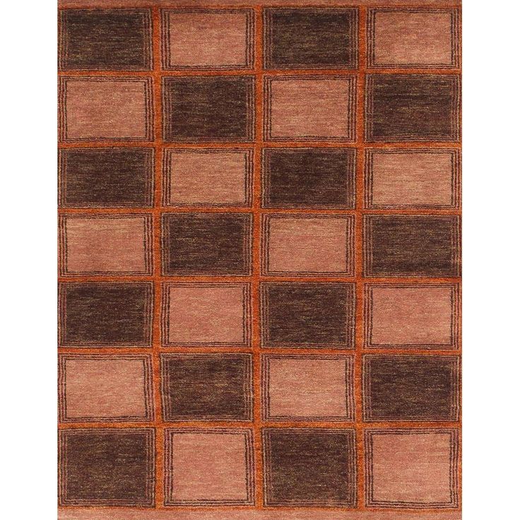 an orange and brown area rug with squares on the bottom, in various shades of brown