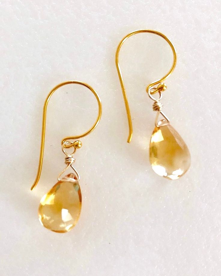 "Lovely golden color citrine pear briolette earrings in 24k gold vermeil or sterling silver.  Faceted citrine gemstones are 12 x 8mm and wire wrapped in gold vermeil on darling little handmade gold vermeil hooks. Total drop is 1 1/4\". Also available in .925 sterling silver." Yellow Gold Gemstone Teardrop Earrings, Gold Briolette Teardrop Handmade Earrings, Gold Teardrop Gemstone Earrings, Handmade Gold Briolette Teardrop Earrings, Handmade Yellow Gold Teardrop Earrings, Teardrop Citrine Earrings For Anniversary, Gold Topaz Birthstone Earrings, Yellow Gold Briolette Citrine Earrings, Gold Pear-shaped Teardrop Earrings In Sterling Silver