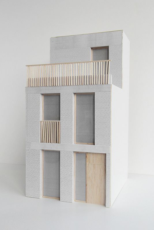 a model of a house with multiple windows and balconies