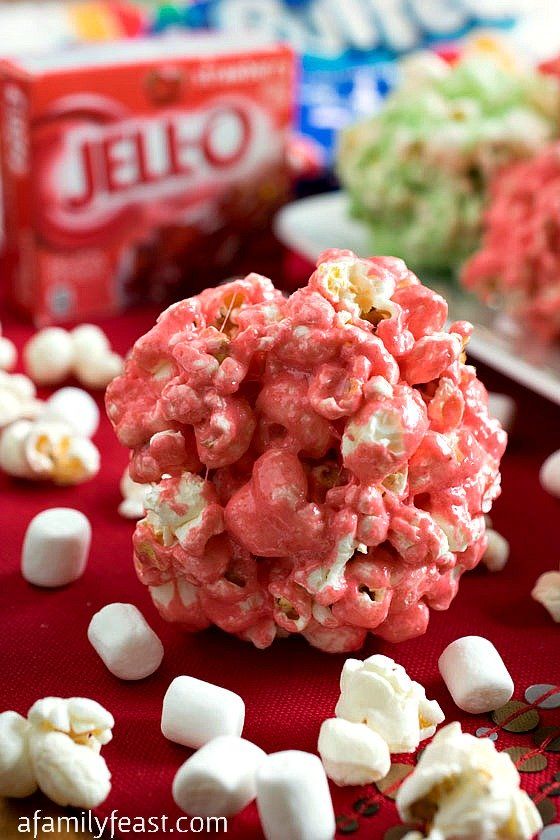 a red table topped with lots of candy and marshmallows