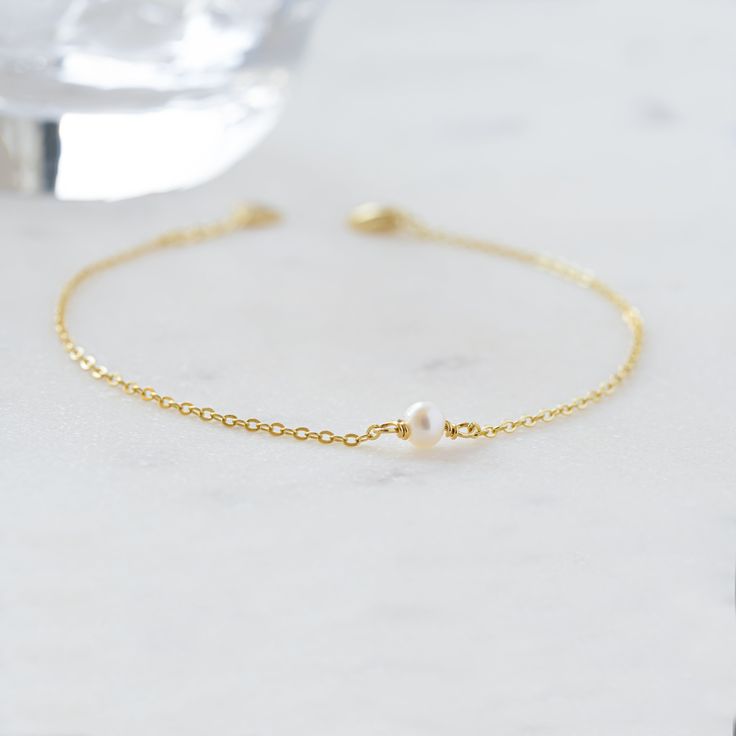 A beautiful and elegant dainty freshwater pearl bracelet. This bracelet is great for stacking or worn on its own for a delicate and minimalist look! Also makes a great gift for bridesmaids! Made of 925 Sterling Silver THICK plating of 14k Gold or Rhodium for a piece that is made to last! Available in 6.25" or 6.75" + .5" extension chain Made of freshwater pearls Nickel-free & Hypoallergenic Pearl Size: 3.5mm Lobster Clasp Closure Classic Pearl Charm Chain Bracelet For Wedding, Elegant Pearl Charm Chain Bracelet For Wedding, Delicate Pearl Drop Bracelet For Formal Occasions, Dainty Pearl Drop Bracelets For Formal Occasions, Elegant Pearl Drop Chain Bracelet Gift, Minimalist Sterling Silver Pearl Bracelet, Minimalist Sterling Silver Pearl Bracelet For Wedding, Dainty Pearl Bracelet For Formal Occasions, Delicate Pearl Charm Bracelet For Formal Occasions