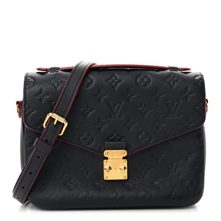 This is an authentic LOUIS VUITTON Empreinte Pochette Metis in Marine and Rouge. This handbag is crafted of navy blue calfskin leather embossed with the Louis Vuitton monogram and trimmed with red resin glazing. The bag features a rear zipper pocket, a navy blue leather top handle, and a removable, adjustable shoulder strap with gold-toned hardware. The crossover flap and s-lock opens to a partitioned striped red fabric interior. Louis Vuitton Empreinte, Red Fabric, Leather Top, Authentic Louis Vuitton, Blue Leather, Embossed Leather, Crossover, Louis Vuitton Monogram, Top Handle