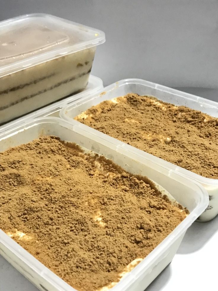 three plastic containers filled with food sitting on top of a white counter next to each other