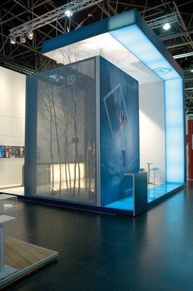 an exhibit booth with blue and white walls