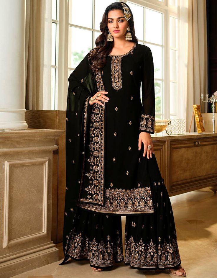 "Discover the allure of the Smoky Black Palazzo Style Salwar Kameez! 🖤💫 This semi-stitched ensemble from Arabic Attire combines contemporary style with traditional elegance. The palazzo pants and intricate design add a touch of sophistication to any occasion. Get ready to make a statement and express your unique fashion sense with this captivating outfit. ✨ #ArabicAttire #SalwarKameez #PalazzoStyle #SemiStitched #ContemporaryElegance #FashionStatement #BlackBeauty" Black Salwar Suit, Black Salwar Kameez, Black Dupatta, Latest Salwar Kameez, Classy Suits, Georgette Dupatta, Palazzo Suit, Sharara Suit, Salwar Kamiz