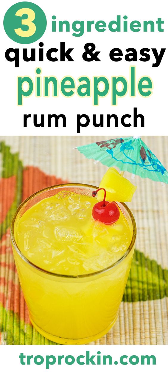 a pineapple rum punch in a glass with an umbrella on the top and text overlay