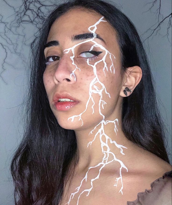 Storm Makeup Look, Lightening Makeup Looks, Lightning Scar Face, Dripping Eye Makeup, Lightening Face Paint, Lighting Bolt Makeup Look, Lighting Bolt Face Paint, Lightning Marks On Skin, Lightning Halloween Costume